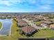 Community overview featuring lake and various homes at 5439 Taliaferro Ct, Palmetto, FL 34221