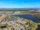 Aerial view of community amenities including pool, tennis courts, and clubhouse at 5439 Taliaferro Ct, Palmetto, FL 34221