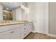 Elegant bathroom with a double vanity and granite countertop at 5439 Taliaferro Ct, Palmetto, FL 34221