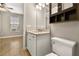 Clean bathroom with vanity, toilet, and built-in shelving at 5439 Taliaferro Ct, Palmetto, FL 34221