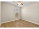 Well-lit bedroom with wood-look floors and ceiling fan at 5439 Taliaferro Ct, Palmetto, FL 34221