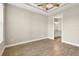Charming bedroom with a view of the bathroom and wood-look floors at 5439 Taliaferro Ct, Palmetto, FL 34221