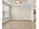 Spacious bedroom featuring wood-look tile floors and ceiling fan at 5439 Taliaferro Ct, Palmetto, FL 34221