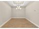 Bright dining room with modern chandelier at 5439 Taliaferro Ct, Palmetto, FL 34221