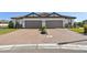 Two-unit building with two-car garages and paver driveway at 5439 Taliaferro Ct, Palmetto, FL 34221