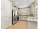 Modern kitchen with stainless steel appliances and gray cabinets at 5439 Taliaferro Ct, Palmetto, FL 34221