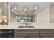 Modern kitchen with stainless steel appliances and gray cabinets at 5439 Taliaferro Ct, Palmetto, FL 34221