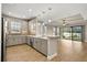 Modern kitchen with stainless steel appliances and gray cabinets at 5439 Taliaferro Ct, Palmetto, FL 34221