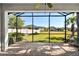 Screened lanai with view of backyard and neighboring homes at 5439 Taliaferro Ct, Palmetto, FL 34221
