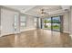 Living room with tile floors, sliding doors to backyard and ceiling fan at 5439 Taliaferro Ct, Palmetto, FL 34221