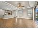 Spacious living room with tile floors, ceiling fan, and access to patio at 5439 Taliaferro Ct, Palmetto, FL 34221