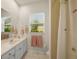 Clean bathroom with a shower and updated vanity at 557 Marsh Creek Rd, Venice, FL 34292
