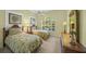 Guest bedroom with twin beds and ample closet space at 557 Marsh Creek Rd, Venice, FL 34292