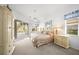 Main bedroom with large windows and access to the pool at 557 Marsh Creek Rd, Venice, FL 34292