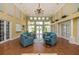 Spacious clubhouse with comfortable seating and high ceilings at 557 Marsh Creek Rd, Venice, FL 34292