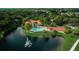Resort-style pool and clubhouse in a lush, tropical setting at 557 Marsh Creek Rd, Venice, FL 34292
