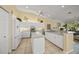 Bright kitchen with island, stainless steel appliances, and white cabinetry at 557 Marsh Creek Rd, Venice, FL 34292