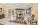 Open living area with views into the kitchen and backyard pool area at 557 Marsh Creek Rd, Venice, FL 34292