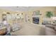 Living area featuring built-in entertainment center and cozy seating at 557 Marsh Creek Rd, Venice, FL 34292