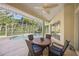 Relaxing screened pool and patio area with seating at 557 Marsh Creek Rd, Venice, FL 34292