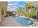 Spacious screened pool area with patio furniture at 557 Marsh Creek Rd, Venice, FL 34292