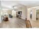 Living room with hardwood floors, recessed lighting and view into dining area at 5857 Pauma Pl, Sarasota, FL 34232