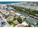 Aerial view of community tennis courts and buildings at 5916 Midnight Pass Rd # 103, Sarasota, FL 34242
