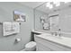 Bathroom with single sink vanity and toilet at 5916 Midnight Pass Rd # 103, Sarasota, FL 34242