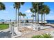 Beachfront view with picnic tables and a well at 5916 Midnight Pass Rd # 103, Sarasota, FL 34242