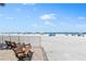 Relaxing beach view with benches at 5916 Midnight Pass Rd # 103, Sarasota, FL 34242