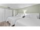Two twin beds, and mirrored closet doors at 5916 Midnight Pass Rd # 103, Sarasota, FL 34242