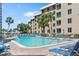 Inviting swimming pool with lounge chairs at 5916 Midnight Pass Rd # 103, Sarasota, FL 34242