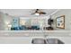 Kitchen features a double sink, stainless steel dishwasher and a view of the living room at 5916 Midnight Pass Rd # 103, Sarasota, FL 34242