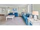 Living area with blue sofas, coffee table and neutral color scheme at 5916 Midnight Pass Rd # 103, Sarasota, FL 34242