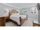 Spacious main bedroom with a king-size bed and wood furniture at 5916 Midnight Pass Rd # 103, Sarasota, FL 34242