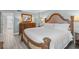 King-size bed, dresser, and ensuite bathroom access at 5916 Midnight Pass Rd # 103, Sarasota, FL 34242