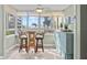 Sunroom with glass windows offering an ocean view and casual seating at 5916 Midnight Pass Rd # 103, Sarasota, FL 34242