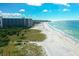 Beachfront view with white sand beach and ocean at 6202 Midnight Pass Rd # 201, Sarasota, FL 34242