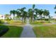 Landscaped walkway leads to the community pool and beach access at 6202 Midnight Pass Rd # 201, Sarasota, FL 34242