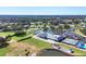 Aerial view of community clubhouse, pool, and golf course at 7133 Cedar Hollow Cir # 22-102, Bradenton, FL 34203