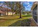 Community backyard with lush green grass and trees at 7133 Cedar Hollow Cir # 22-102, Bradenton, FL 34203