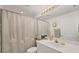 Clean bathroom with tub shower combo, vanity, and updated fixtures at 7133 Cedar Hollow Cir # 22-102, Bradenton, FL 34203