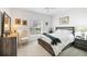 Comfortable guest bedroom with a queen-size bed and plenty of natural light at 7133 Cedar Hollow Cir # 22-102, Bradenton, FL 34203