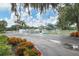 Community pool area with parking and lush landscaping at 7133 Cedar Hollow Cir # 22-102, Bradenton, FL 34203