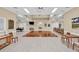 Bright community room with hardwood floors and tables at 7133 Cedar Hollow Cir # 22-102, Bradenton, FL 34203