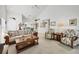 Vaulted ceiling living room with ample seating and dining area at 7133 Cedar Hollow Cir # 22-102, Bradenton, FL 34203