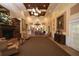 Elegant lobby with fireplace, seating area, and high ceilings at 7133 Cedar Hollow Cir # 22-102, Bradenton, FL 34203