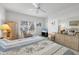 Large main bedroom with king bed, wicker furniture, and plenty of natural light at 7133 Cedar Hollow Cir # 22-102, Bradenton, FL 34203