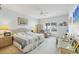 Spacious main bedroom with a king-size bed, ceiling fan, and ample natural light at 7133 Cedar Hollow Cir # 22-102, Bradenton, FL 34203