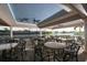 Relaxing outdoor patio area with tables and chairs overlooking the lake at 7133 Cedar Hollow Cir # 22-102, Bradenton, FL 34203